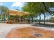 Gathering-friendly playground with a splash pad and covered play structures at 10252 E Butherus Dr, Scottsdale, AZ 85255