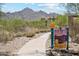 Scenic walking trail with views of the mountains and desert flora at 10252 E Butherus Dr, Scottsdale, AZ 85255