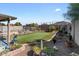 Well maintained backyard features a manicured lawn and small pond at 1057 E Silversmith Trl, San Tan Valley, AZ 85143