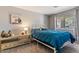 Comfortable bedroom featuring neutral walls and bright natural light at 1057 E Silversmith Trl, San Tan Valley, AZ 85143