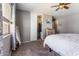 Bedroom featuring neutral tones, a ceiling fan, and a closet with ample storage at 1057 E Silversmith Trl, San Tan Valley, AZ 85143