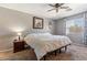 Bedroom with a plush carpet, neutral walls, and ample natural light at 1057 E Silversmith Trl, San Tan Valley, AZ 85143
