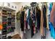 Walk-in closet offers extensive storage and organization options at 1057 E Silversmith Trl, San Tan Valley, AZ 85143