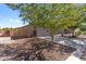 Charming single-story home featuring a two-car garage, front porch, and desert landscaping at 1057 E Silversmith Trl, San Tan Valley, AZ 85143