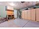 Spacious garage with storage cabinets, pegboard, and epoxy floors at 1057 E Silversmith Trl, San Tan Valley, AZ 85143