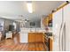 Open-concept kitchen with wood floors, stainless appliances, and plenty of counter space at 1057 E Silversmith Trl, San Tan Valley, AZ 85143