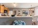 Bright kitchen boasts stainless appliances, marble counters, and backyard views at 1057 E Silversmith Trl, San Tan Valley, AZ 85143