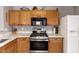 Close-up highlighting the stainless steel appliances and countertops in the kitchen at 1057 E Silversmith Trl, San Tan Valley, AZ 85143