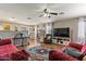 Inviting living room showcasing comfortable seating, wood flooring, and modern decor at 1057 E Silversmith Trl, San Tan Valley, AZ 85143