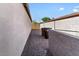 Side yard shows gravel and separation from neighboring property with block fence at 1057 E Silversmith Trl, San Tan Valley, AZ 85143