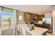 Bright, modern kitchen with stainless appliances and a breakfast bar for casual dining at 11982 E Primrose Ln, Florence, AZ 85132