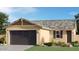 Charming single-story home with a two-car garage and well-maintained landscaping at 12438 E Verbina Ln, Florence, AZ 85132