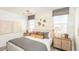 Relaxing main bedroom with coordinated décor, textured wallpaper, and warm lighting, creating a cozy and inviting atmosphere at 12438 E Verbina Ln, Florence, AZ 85132