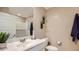 Bright bathroom offers a vanity with a sink, toilet, and a shower/tub combination at 12469 E Verbina Ln, Florence, AZ 85132