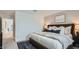 Comfortable bedroom with neutral decor, carpet floors, and ample natural light at 12469 E Verbina Ln, Florence, AZ 85132