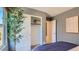 Stylish bedroom with gray walls, white trim, and a closet with sliding doors, bathed in soft, natural light at 12469 E Verbina Ln, Florence, AZ 85132