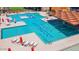 Aerial of pool and basketball court at community center with lounge chairs for relaxation at 12469 E Verbina Ln, Florence, AZ 85132