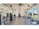 Well-equipped fitness center with modern exercise machines and ample natural light at 12469 E Verbina Ln, Florence, AZ 85132