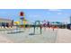 Gathering-friendly splash pad with colorful water features and shaded lounge seating at 12469 E Verbina Ln, Florence, AZ 85132