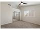 Bright bedroom featuring neutral walls, plush carpeting, and a large mirrored closet at 12935 E Mercer Ln, Scottsdale, AZ 85259
