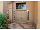 Inviting front entrance featuring a double door with sidelights and decorative stone pathway at 12935 E Mercer Ln, Scottsdale, AZ 85259