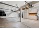 Spacious garage with ample storage cabinets, and a clean, well-organized layout at 12935 E Mercer Ln, Scottsdale, AZ 85259