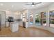 Bright kitchen with white cabinetry, stainless steel appliances, and a view of the sparkling pool at 12935 E Mercer Ln, Scottsdale, AZ 85259