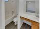 Bathroom with a shower-tub combo, single sink vanity, and modern fixtures at 13030 W Hearn Rd, El Mirage, AZ 85335