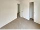 Bedroom featuring closet with sliding doors and carpet flooring at 13030 W Hearn Rd, El Mirage, AZ 85335