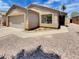 Charming single-story home with a two-car garage, neutral stucco, concrete driveway, and desert landscaping at 13030 W Hearn Rd, El Mirage, AZ 85335