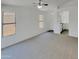 Spacious living room with multiple windows and neutral carpet at 13030 W Hearn Rd, El Mirage, AZ 85335
