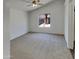 Vaulted ceiling main bedroom with a king bed, fluffy rug, and view to the outside at 13030 W Hearn Rd, El Mirage, AZ 85335