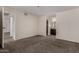 Spacious carpeted bedroom with easy access to ensuite bathroom with wood-style flooring at 154 W 5Th St # 210, Tempe, AZ 85281
