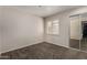 Carpeted bedroom featuring a window and closet at 154 W 5Th St # 210, Tempe, AZ 85281