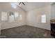 Open living area boasts vaulted ceilings, round window, and abundant natural light at 154 W 5Th St # 210, Tempe, AZ 85281