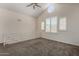 Cozy loft space features vaulted ceiling, unique round window, and neutral carpet at 154 W 5Th St # 210, Tempe, AZ 85281