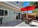 Inviting backyard patio featuring an umbrella-covered dining area, ideal for outdoor entertaining at 1600 N Saba St # 214, Chandler, AZ 85225