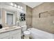 Bathroom featuring a combined bathtub and shower, with a designer mirror and decorative accents at 1600 N Saba St # 214, Chandler, AZ 85225