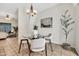 Dining area with a glass table, modern lighting, and access to outdoor area at 1600 N Saba St # 214, Chandler, AZ 85225