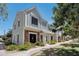 Charming two-story townhome with light-blue wood siding and a brick accent on the lower level at 1600 N Saba St # 214, Chandler, AZ 85225