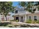 Charming two-story townhome features light-blue wood siding and mature landscaping at 1600 N Saba St # 214, Chandler, AZ 85225