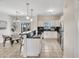 Modern kitchen with white cabinetry, granite countertops, breakfast bar, and stainless steel appliances at 1600 N Saba St # 214, Chandler, AZ 85225