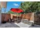 Charming patio featuring dining table and chairs, complete with brick surround and lush greenery at 1600 N Saba St # 214, Chandler, AZ 85225
