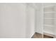 Well-organized walk-in closet with built-in shelving provides efficient storage solutions at 1600 N Saba St # 214, Chandler, AZ 85225