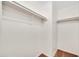 Walk-in closet offers ample storage with rods and shelving, perfect for organization at 1600 N Saba St # 214, Chandler, AZ 85225