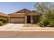 Charming single-story home showcasing a two-car garage and cozy front porch at 17038 W Mohave St, Goodyear, AZ 85338