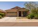 Charming single-story home featuring a well-maintained yard and a cozy front porch at 17038 W Mohave St, Goodyear, AZ 85338