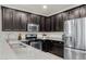 Well-equipped kitchen with updated appliances, granite countertops, and stylish cabinetry at 17038 W Mohave St, Goodyear, AZ 85338