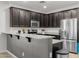 Modern kitchen featuring stainless steel appliances, sleek countertops, and ample storage space at 17038 W Mohave St, Goodyear, AZ 85338