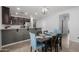 Bright kitchen with a dark wood table and unique patterned chairs at 17038 W Mohave St, Goodyear, AZ 85338